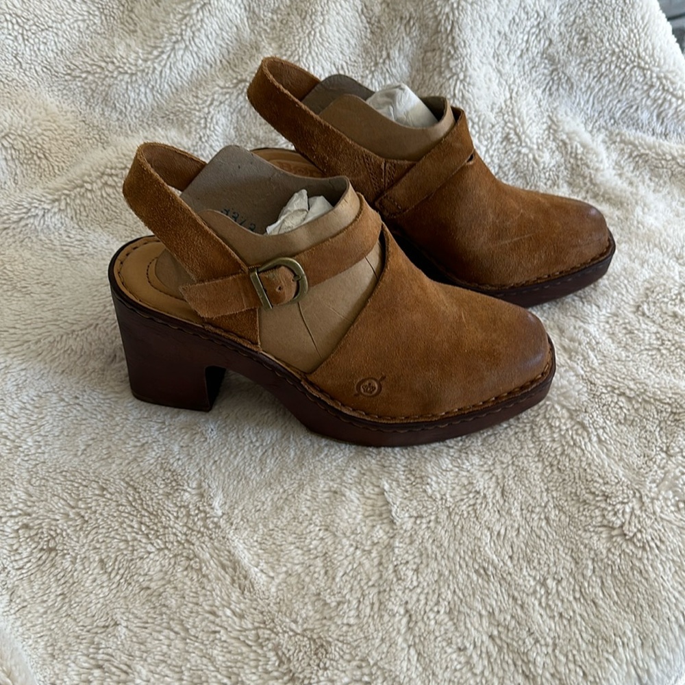New without tags.  Beautiful sueded clogs with strap.  Worn once in house.